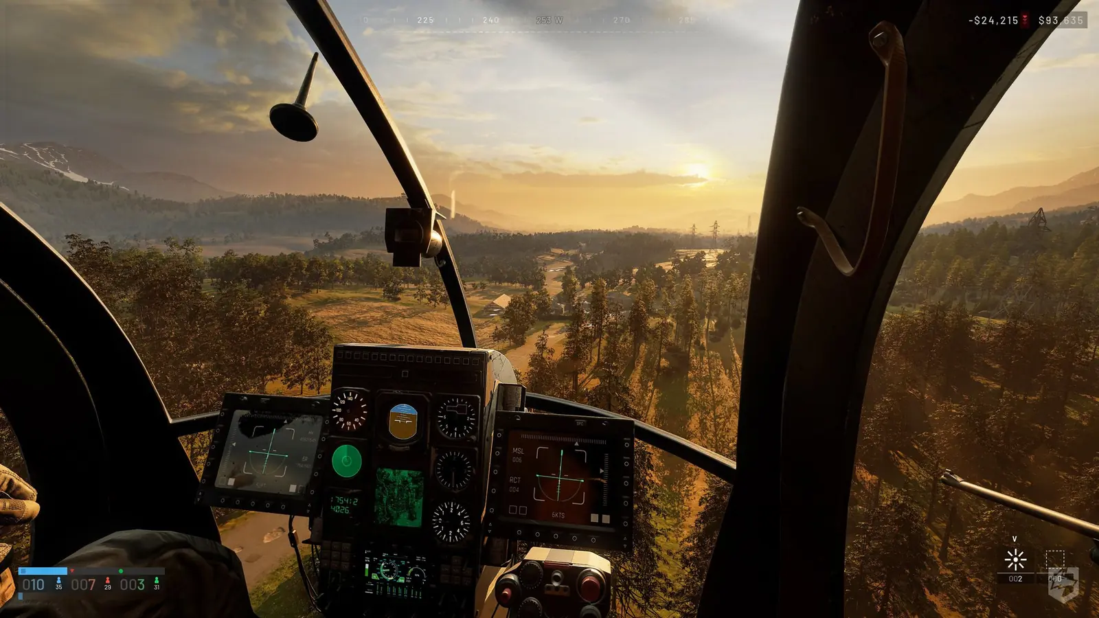 Vista desde la cabina de un helicóptero sobre un bosque al atardecer